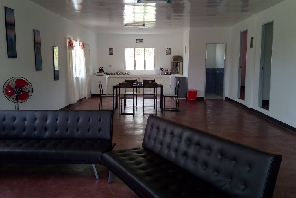Living Area and Kitchen with Dining Table and Chairs