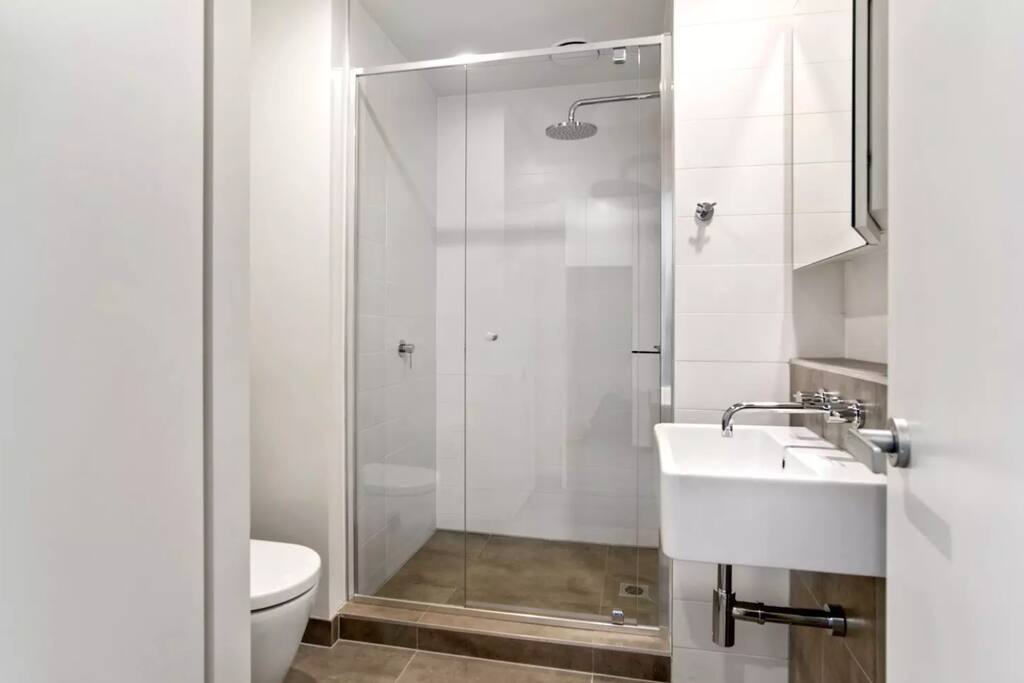 Private Bathroom with towels and shampoo.