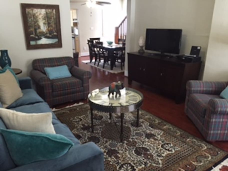 The large living room, provides ample seating with views to the dining room.