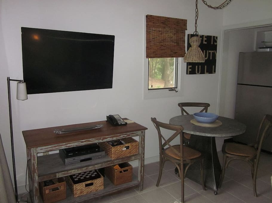 Large flat screen with HD cable. The TV can be viewed from the screened porch.