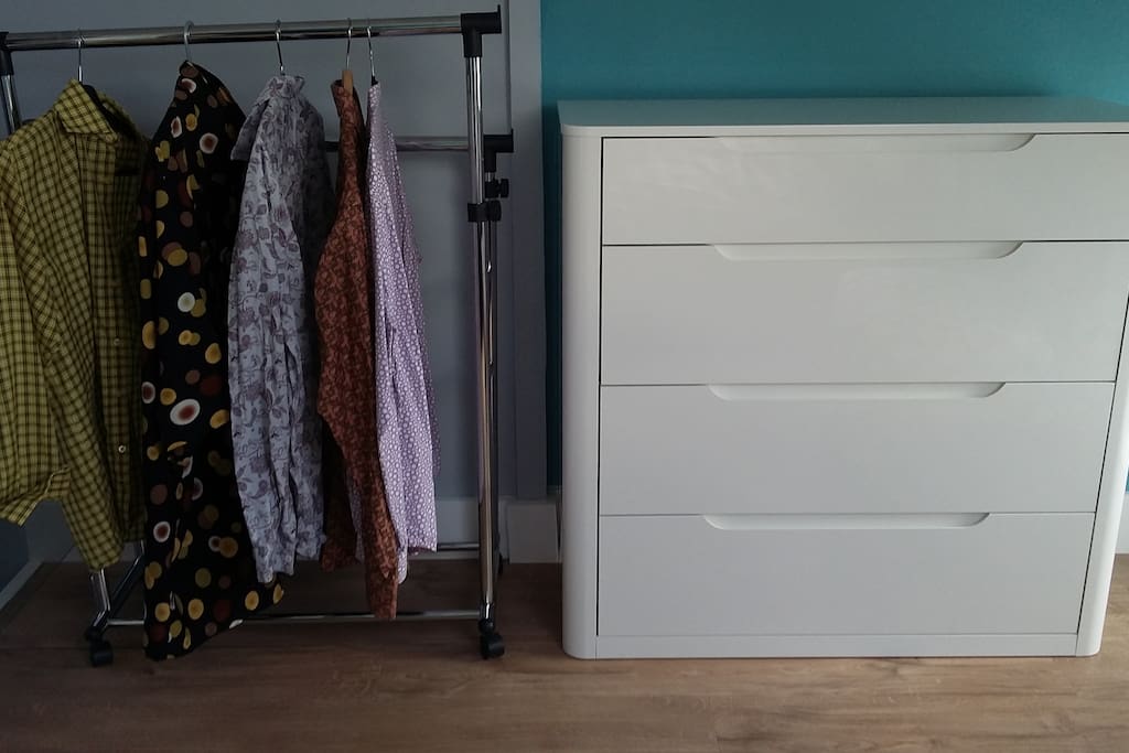 chest of draws and clothes rail