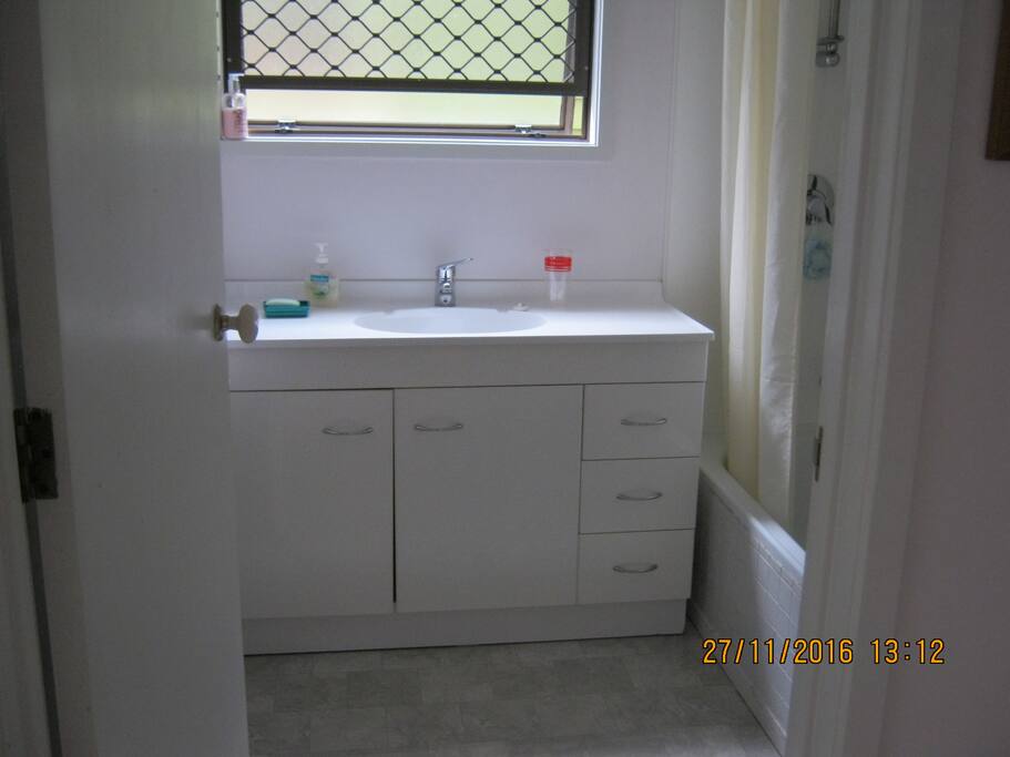 Shower and bath in bathroom