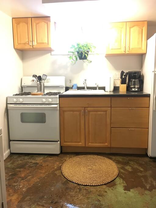 Guests have access to small but amply-stocked kitchen during their stay. Kitchen is equipped with coffee machine (assortment of teas and coffee), full dining set, pots/pans, cutlery and Brita water filter.