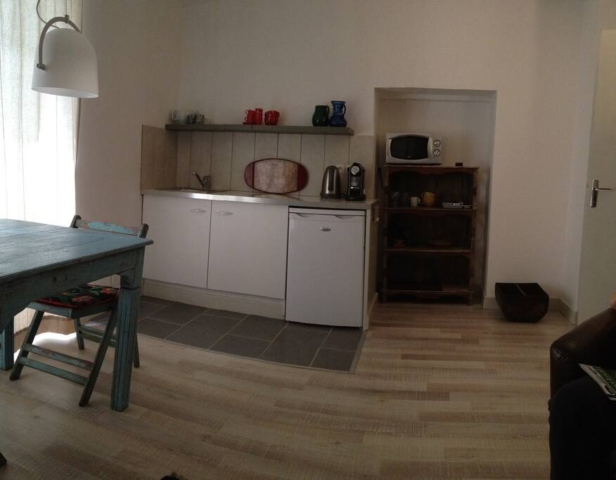kitchenette with Nespresso machine, water boiler, Microwave and refrigarator