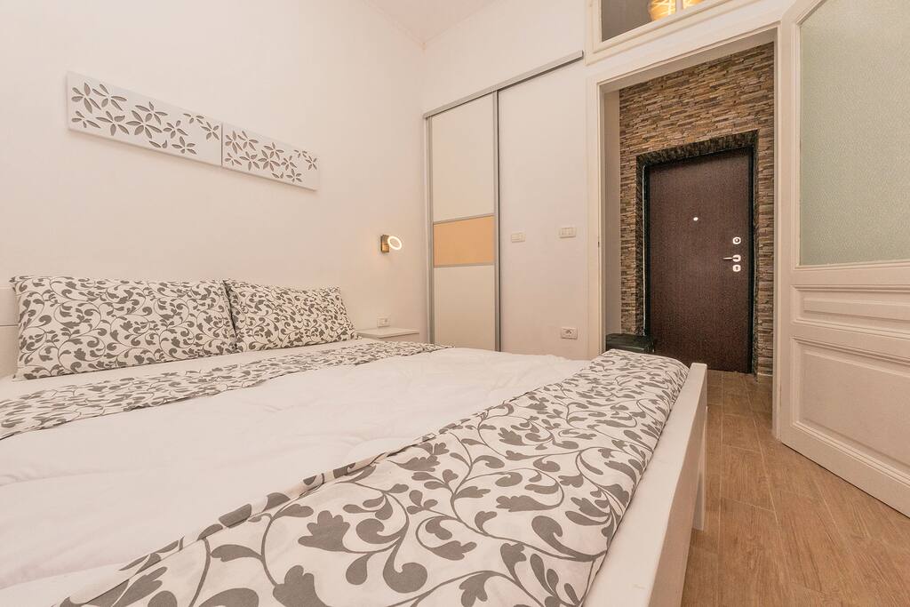 bedroom with double bed and wardrobe