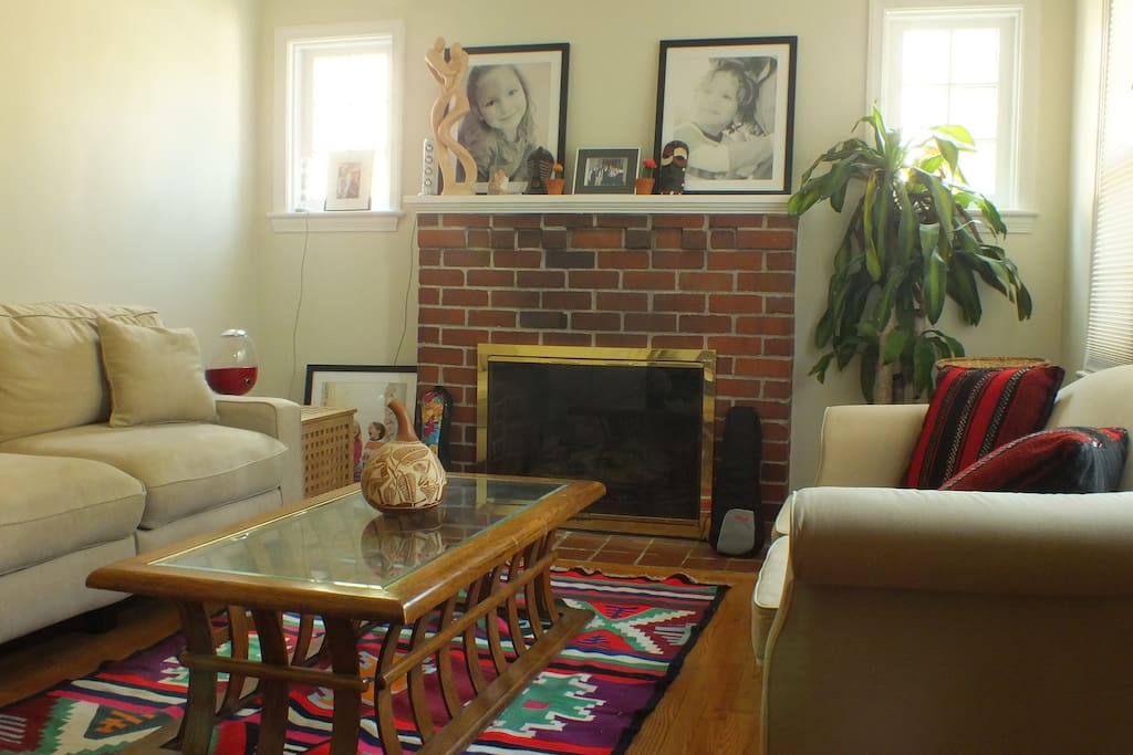 Living room with a working fireplace -- cozy!