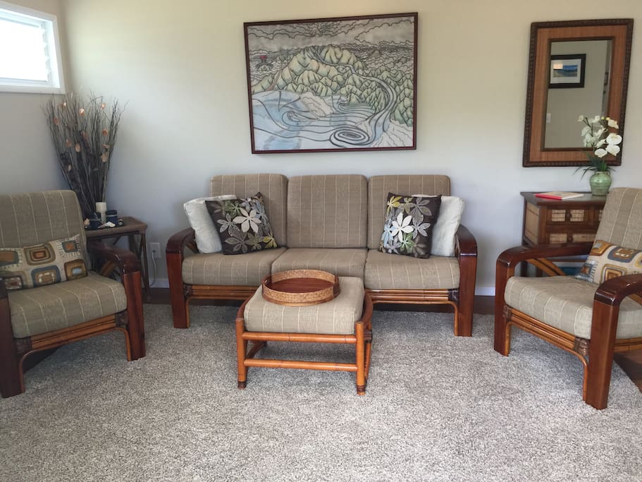 Living room, designer tropical furnishings, local artwork