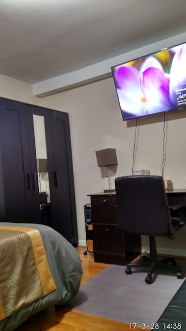 desk,big cable tv, wardrobe.