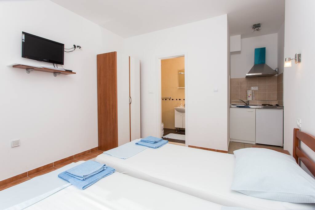 As you can see, in this open floor space you have a wardrobe, Flat Screen TV...
