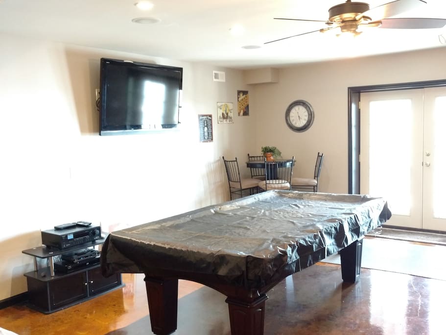 Common area,Pool table, TV, Love seat opens to Lake and patio.