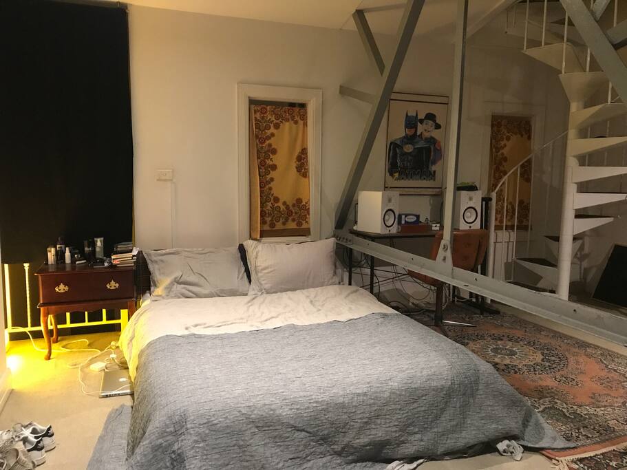 The room. The bed is a super comfortable Queen with great quality sheets and bedding. Large room with private lounge area