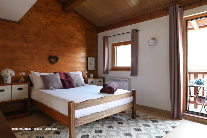 Master bedroom with double bed and balcony