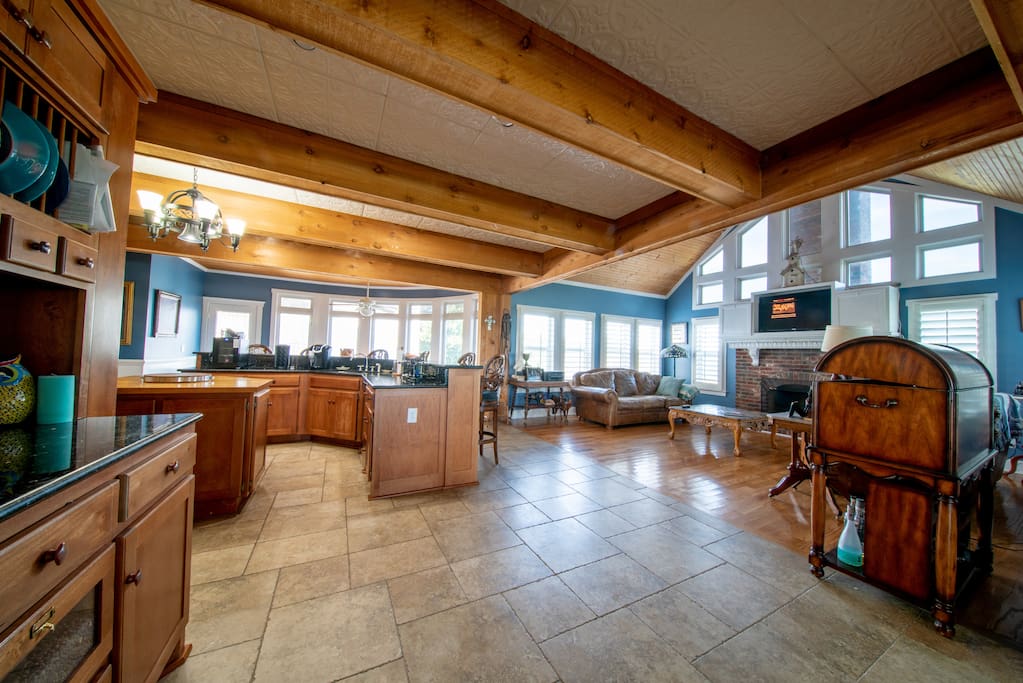 Spacious kitchen & glassed living room.