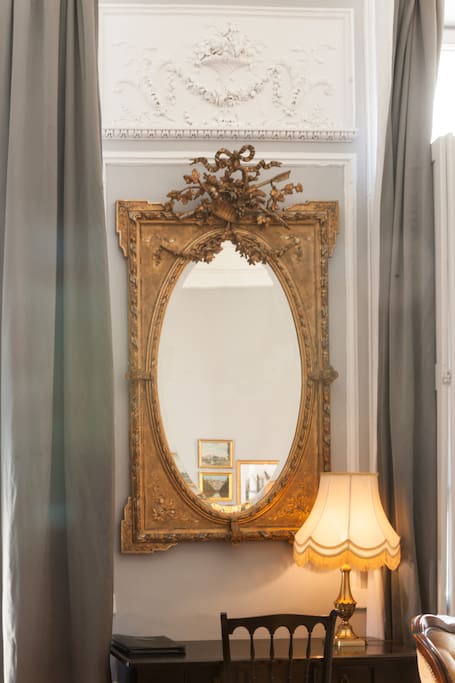 Classic French decor in a gorgeous historical 1600's apartment with grey walls and white moldings in Carcassonne. #vacationrental #French #classicFrench #Paris #Frenchdecor