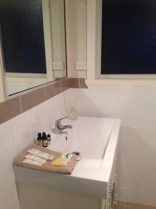 Private bathroom with a separate toilet..