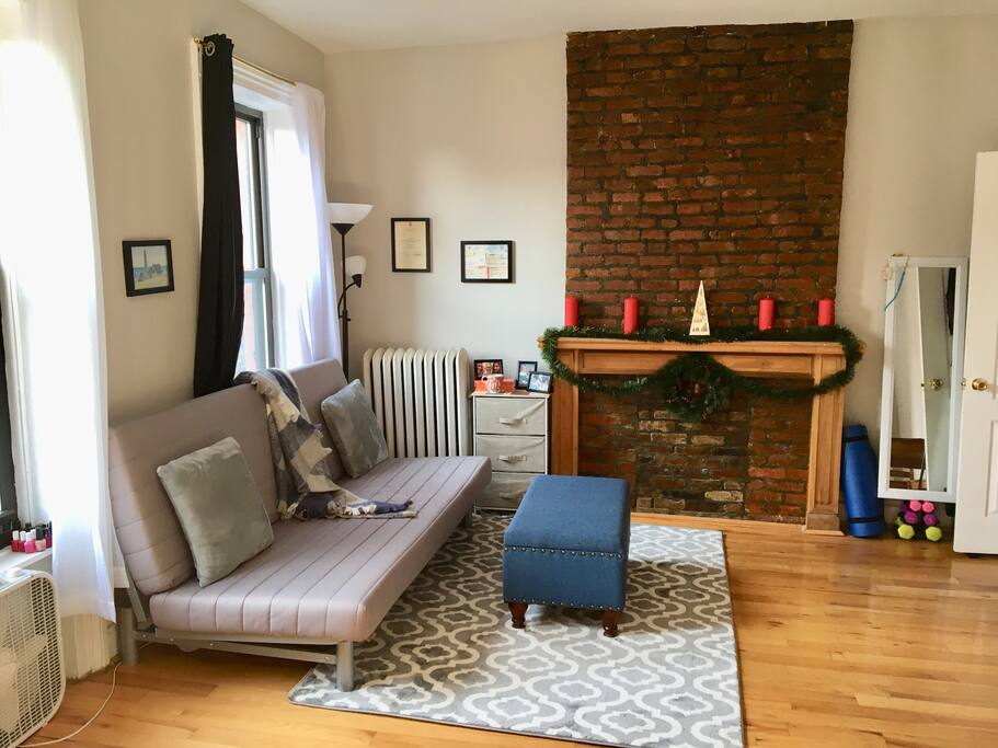 Comfy couch with snuggly blankets and pillows
