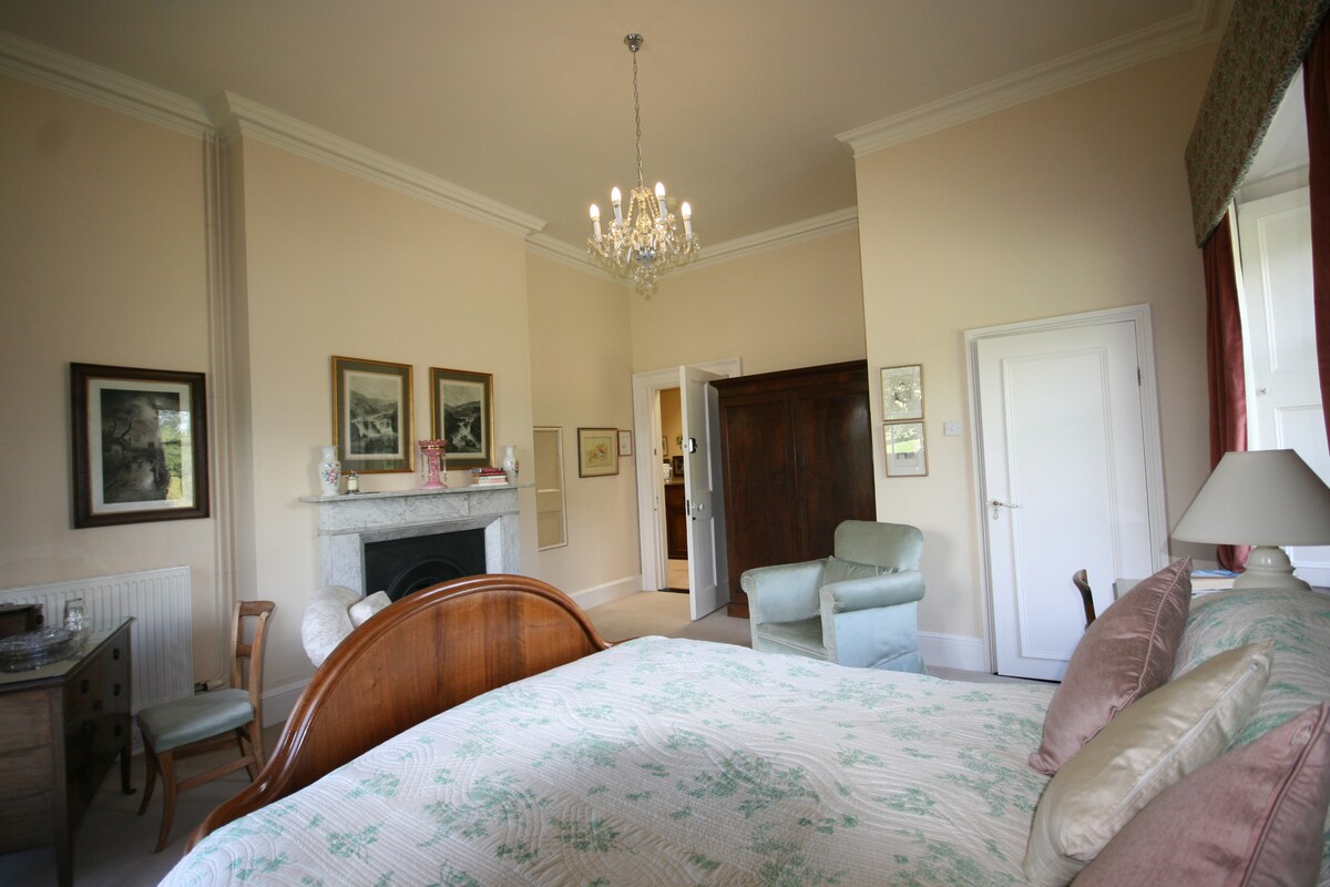 The Pink Bedroom - named for the beautiful lustreware vase on the mantlepiece. It has a bijoux ensuite bathroom with shower and dual aspect windows with lovely views over the grounds.  The bed is French walnut with a bespoke mattress.