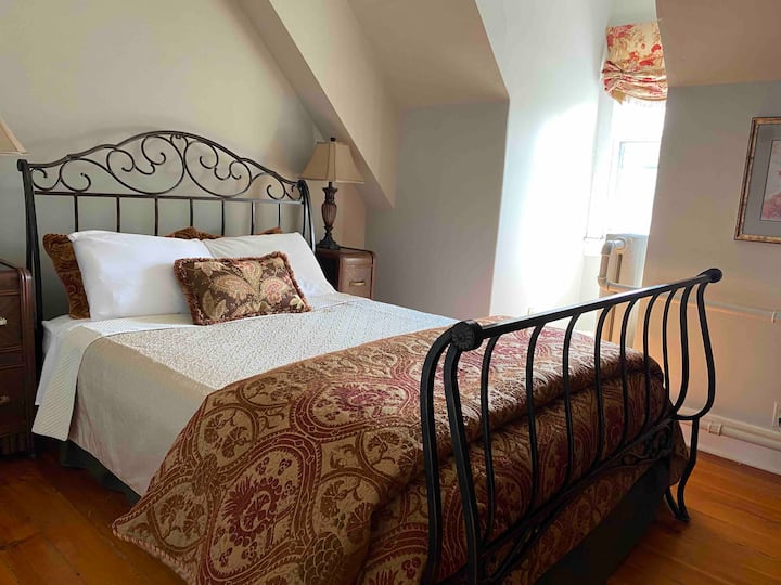 Third floor bedroom; queen bed.