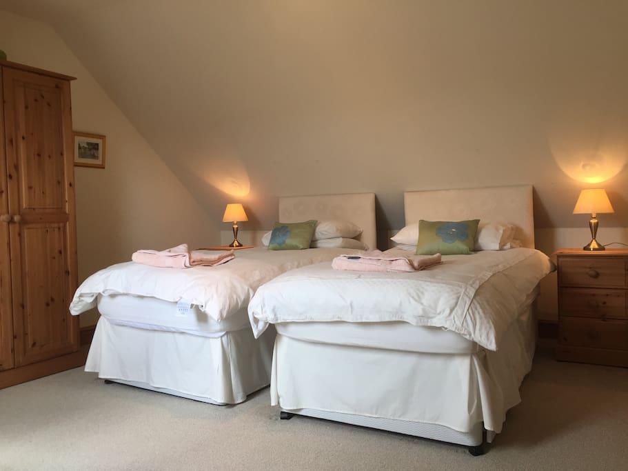 Our upstairs bedroom is made up as a twin but beds can be linked together to create another super king bed. This bedroom also has an ensuite shower room.