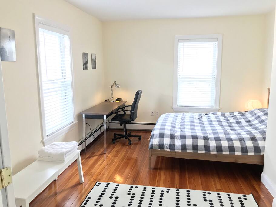 1st Bedroom: Double French doors from the living room into the bright room with Queen Bed and foam mattress
