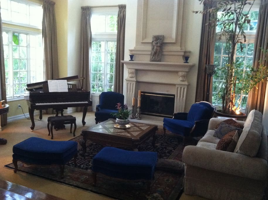 Living room with gas fireplace and player piano
