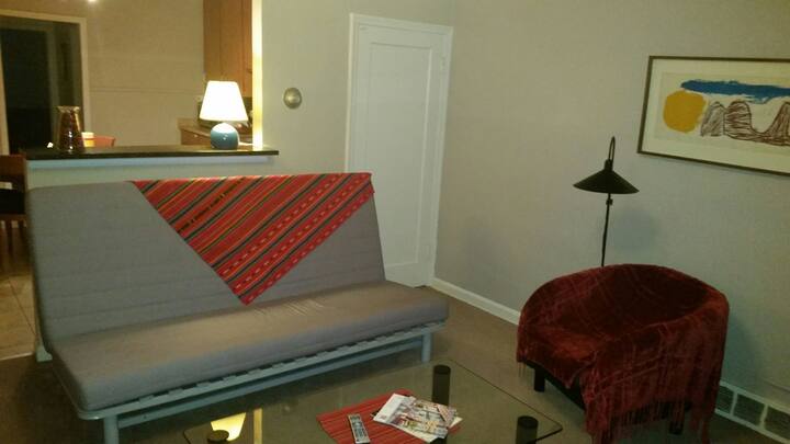 Welcoming living room with futon for extra guest.