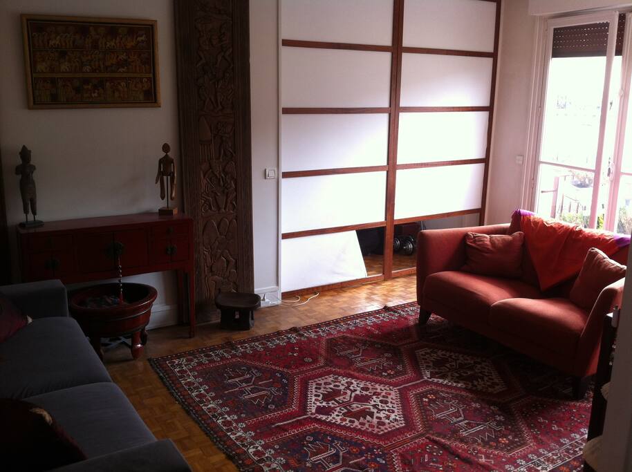 Your room with couch and balcony (separate from my room by the japanese doors)
