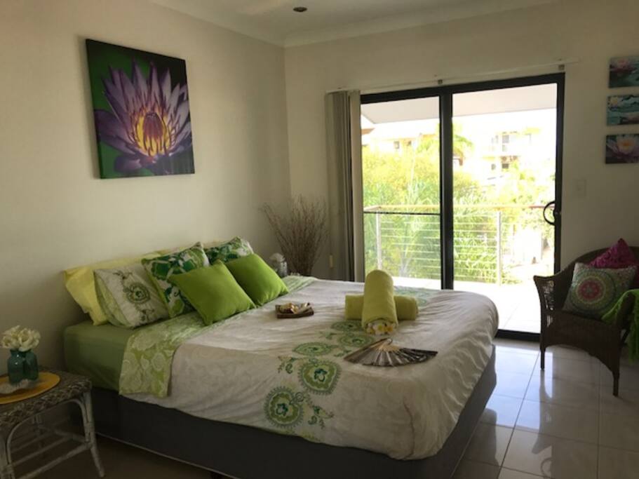 Spacious queen bedroom with balcony