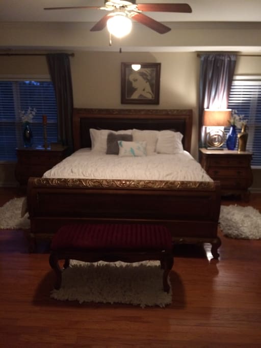 Master suite king size mattress with sitting area, fireplace and jacuzzi bathtub