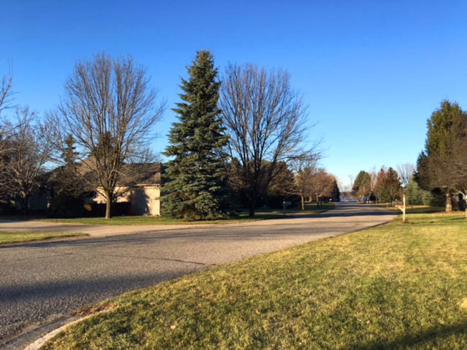 View of house with lake access at the end of the street