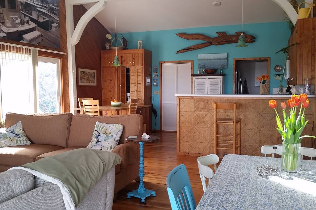 Open nautical living space with cheery sunlight