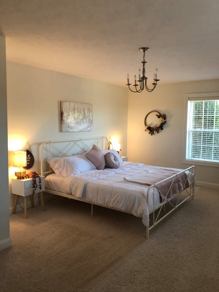 Master Bedroom with ensuite master bathroom and walk-in closet with additional closet 