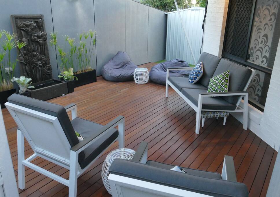 outdoor entertaining deck and tranquil water feature