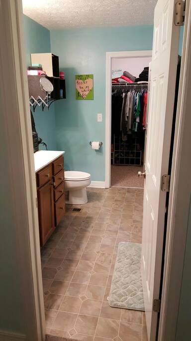Master bedroom into walk-in closet; double vanity and new toilet