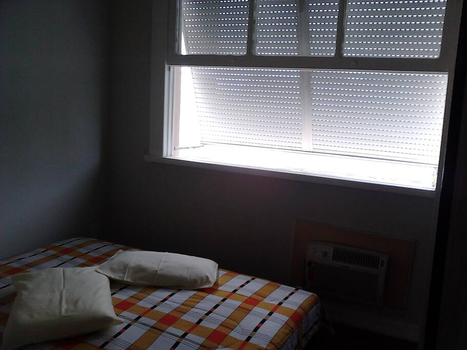 Bedroom window and queen-sized bed