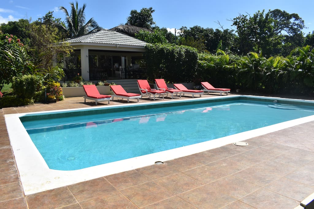 Large pool, chairs to relax on and a cabana to enjoy cool drinks and barbecue under.