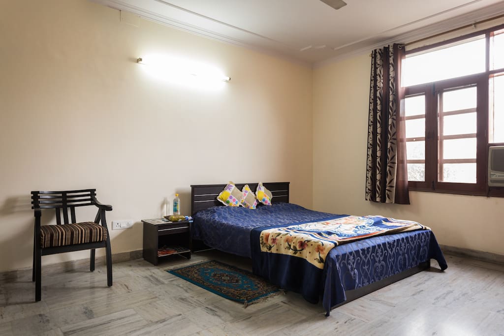 The bedroom with ample sunlight.