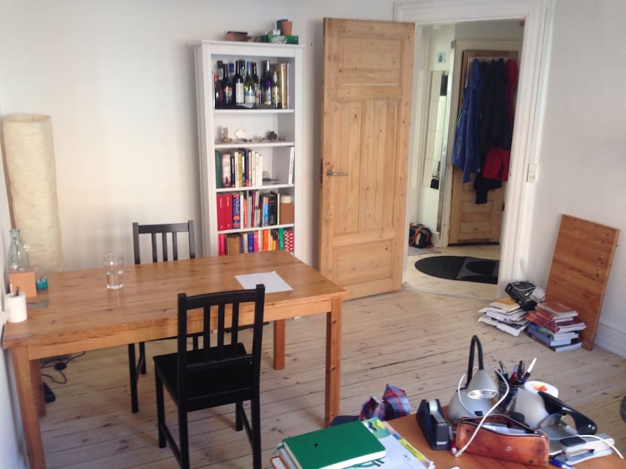 Living/dining room 2. The staple of books in the corner has been replaced with a chest of drawers where you can store your stuff if you like to unpack bags/suitcases.