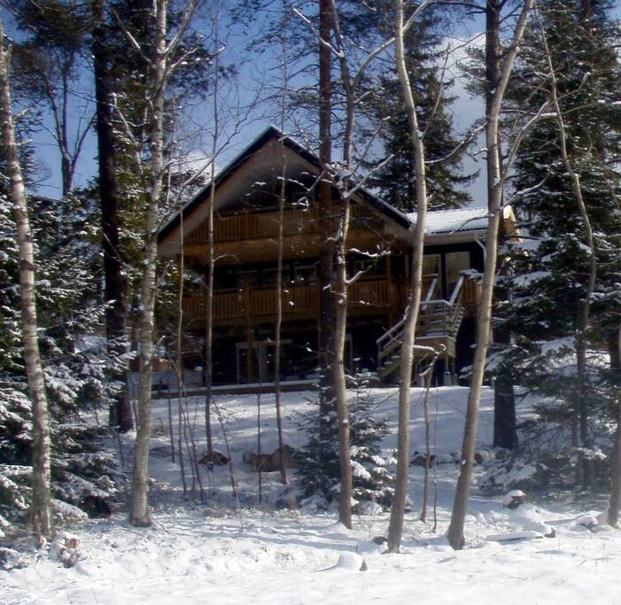 Back of House in March 2018. Three minutes walk through trees to secluded lake surrounded by cliffs.