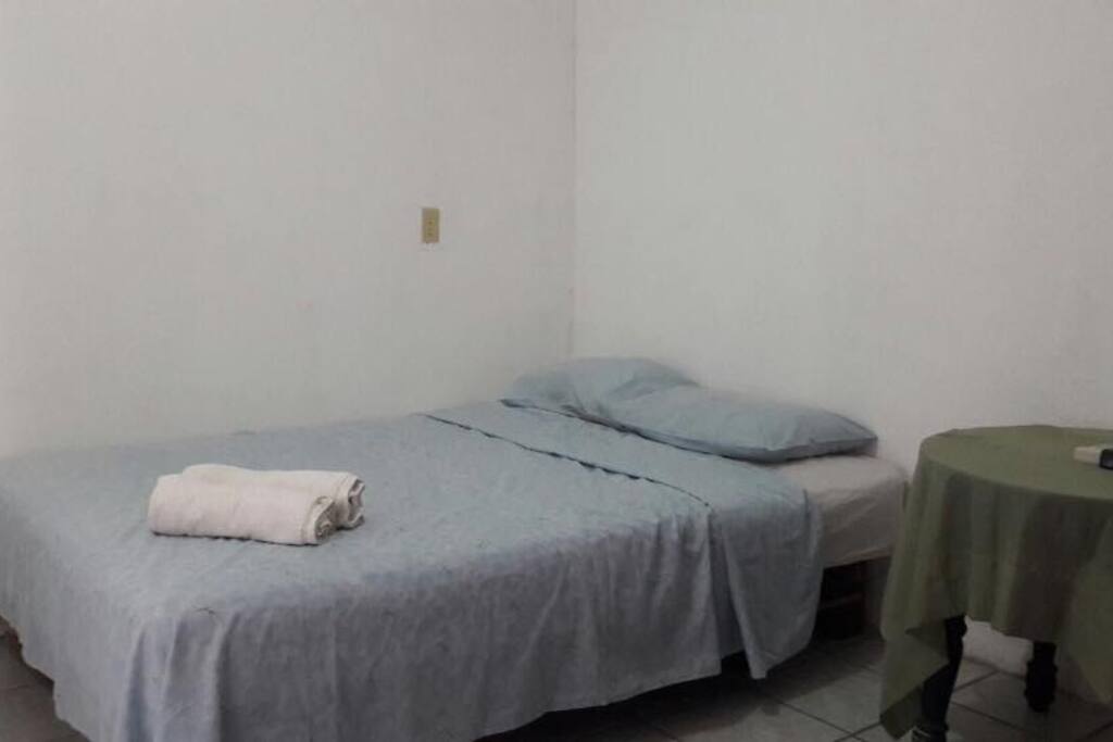 The private room has two queen-sized beds, a powerful air-conditioner, and a flatscreen TV mounted on the wall (cable included). Bedroom has a separate set of keys to ensure safe storage of your belongings.