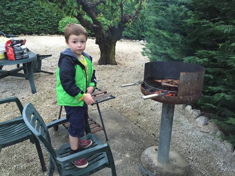 Our little boy supervising the grill