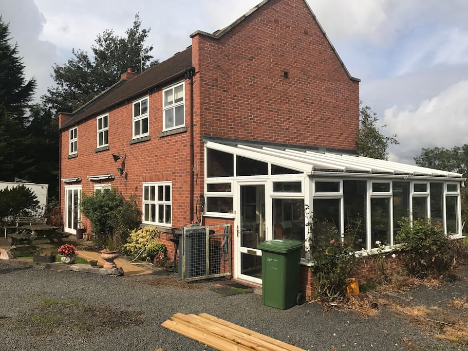 Side view, with conservatory.