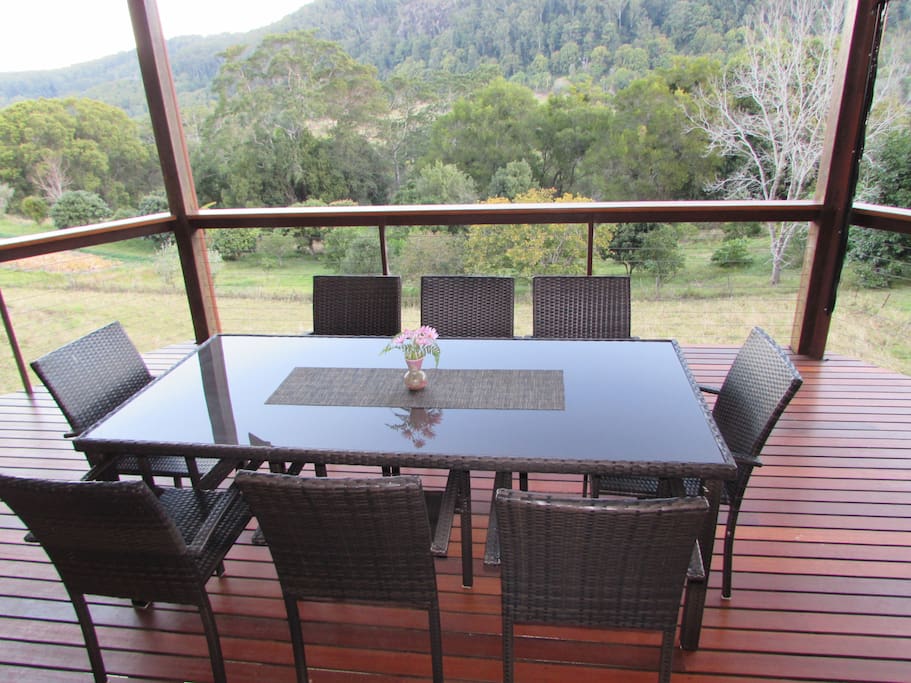 8 seat table on the verandah with expansive views of the valley and gentle breeze in summer