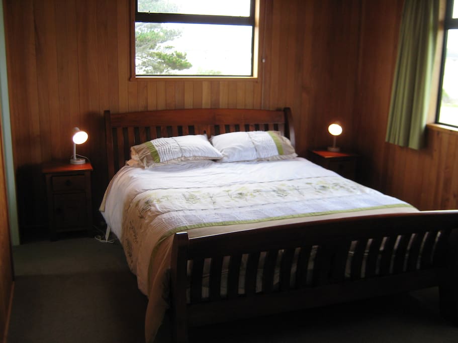 Enjoy views of the estuary and the mountains from the bedroom.