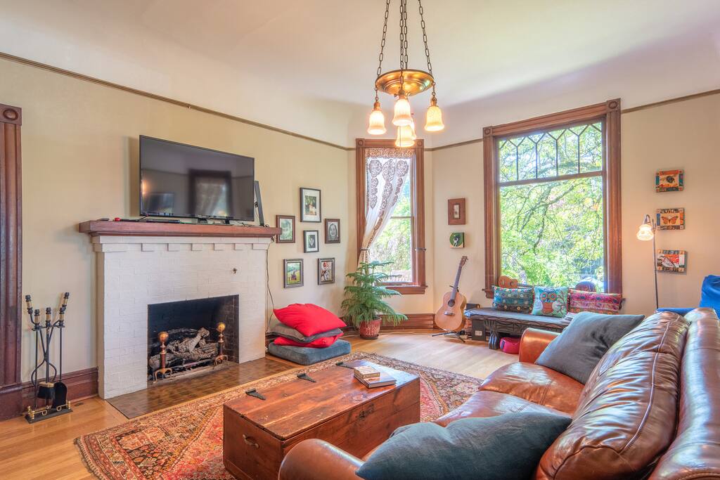 In living room gas fireplace and large flatscreen with Roku for streaming.