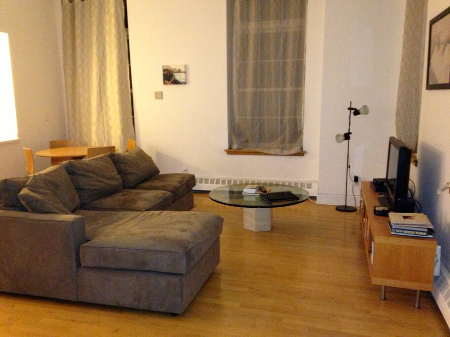 Living room - 14' ceiling, 10' foot windows, nestled in the back of the building facing a courtyard