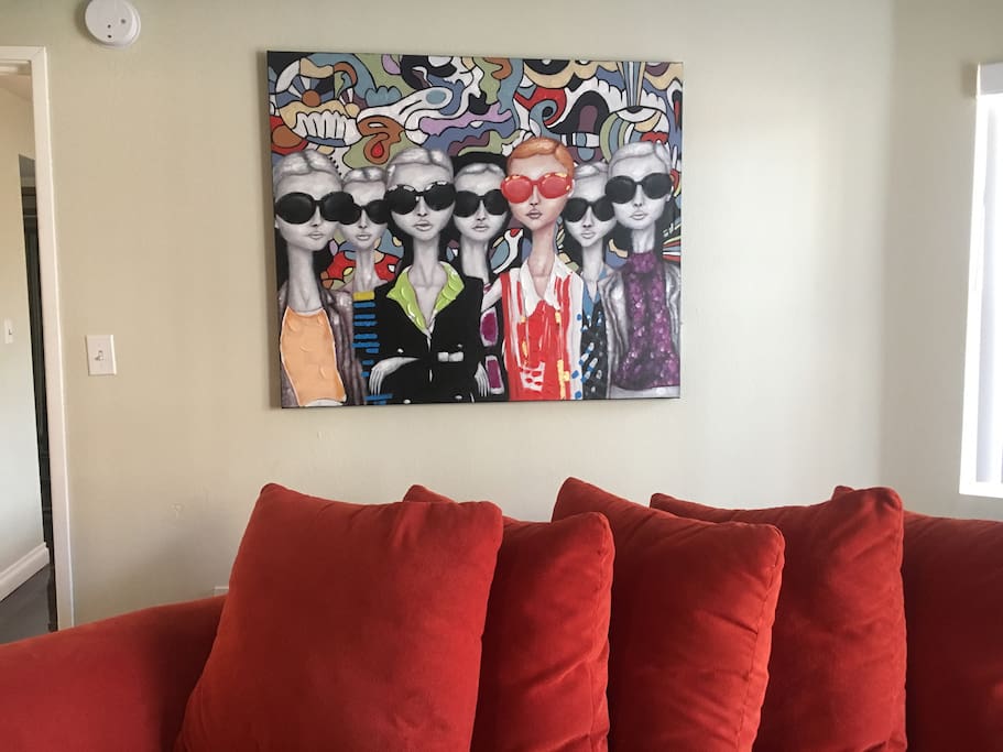 Better view of the painting near the very comfortable sectional couch.