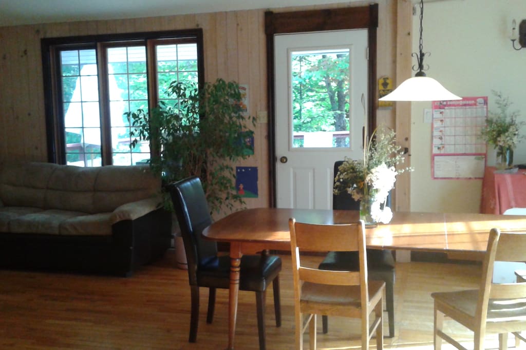 The dining and top floor living room with access to balcony