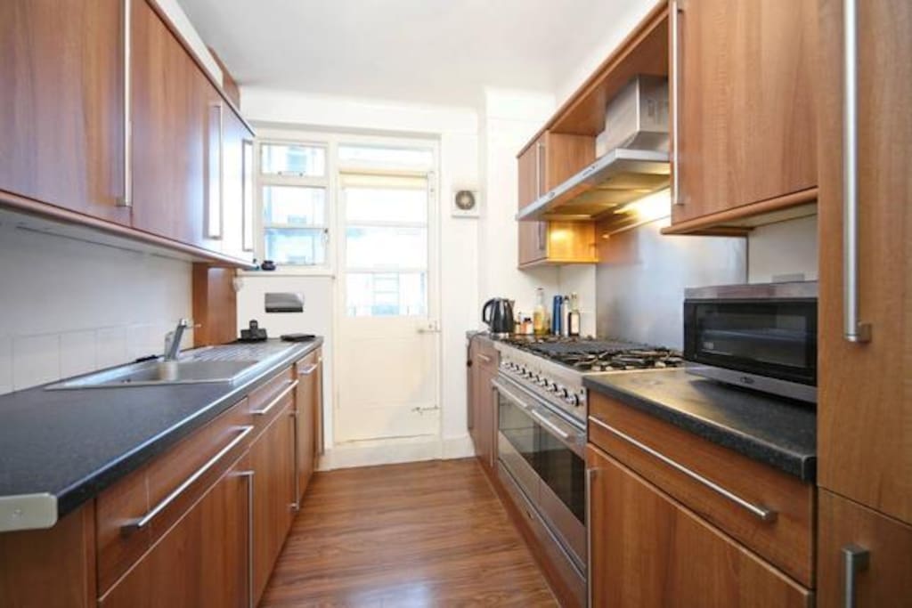 Modern kitchen with washer and dryer