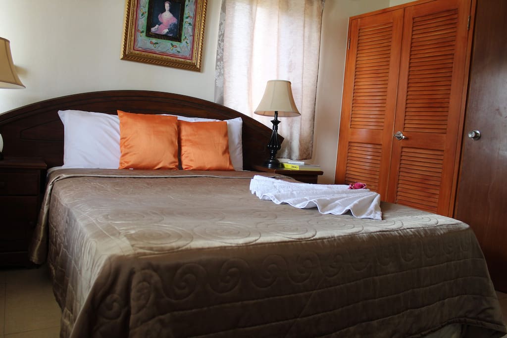 Comfortable queen sized bed where you can rest in air conditioned comfort.